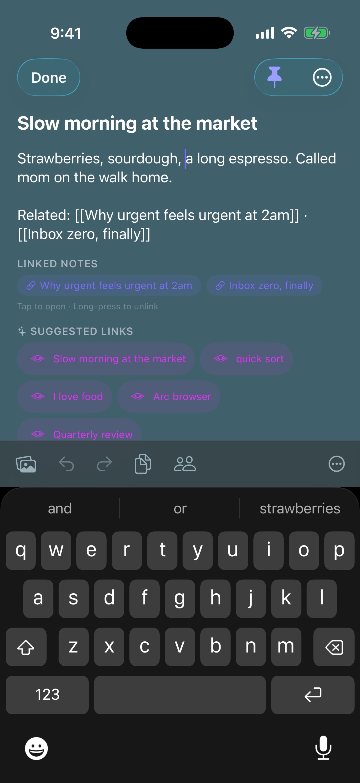 iPhone editor with the action toolbar riding above the keyboard